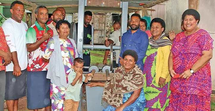 Members of the Nasaqalau Farmers Club at Welagi, Taveuni with their yaqona pounding machine. Photo: Fiji Government