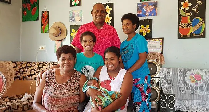 Ulamila Reva holding her son, Peni Aspen Seniceva Nakulanikoro with her family members at their home in Ba on April 16, 2022. Photo: Nicolette Chambers