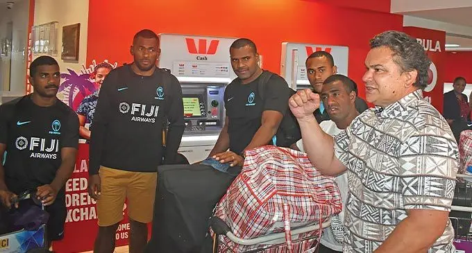 Sir Michael Jones (right), with the Fijian 7s reps (from left) Pilipo Bukayaro, Sevuloni Mocenacagi, Josua Vakurunabili, Jerry Matana and Filipe Sauturaga at the Nadi International Airport on November 8, 2022. Photo: Waisea Nasokia