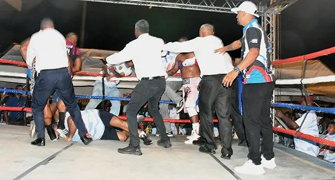 One of the handlers of heavyweight boxer James Singh hits the canvas during the brawl as ring officials move in to control the situation at Sigatoka’s Lawaqa Park on August 31, 2024. Photo: Waisea Nasokia