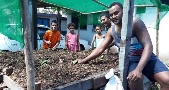 Foame Kata with his family at their nursery.