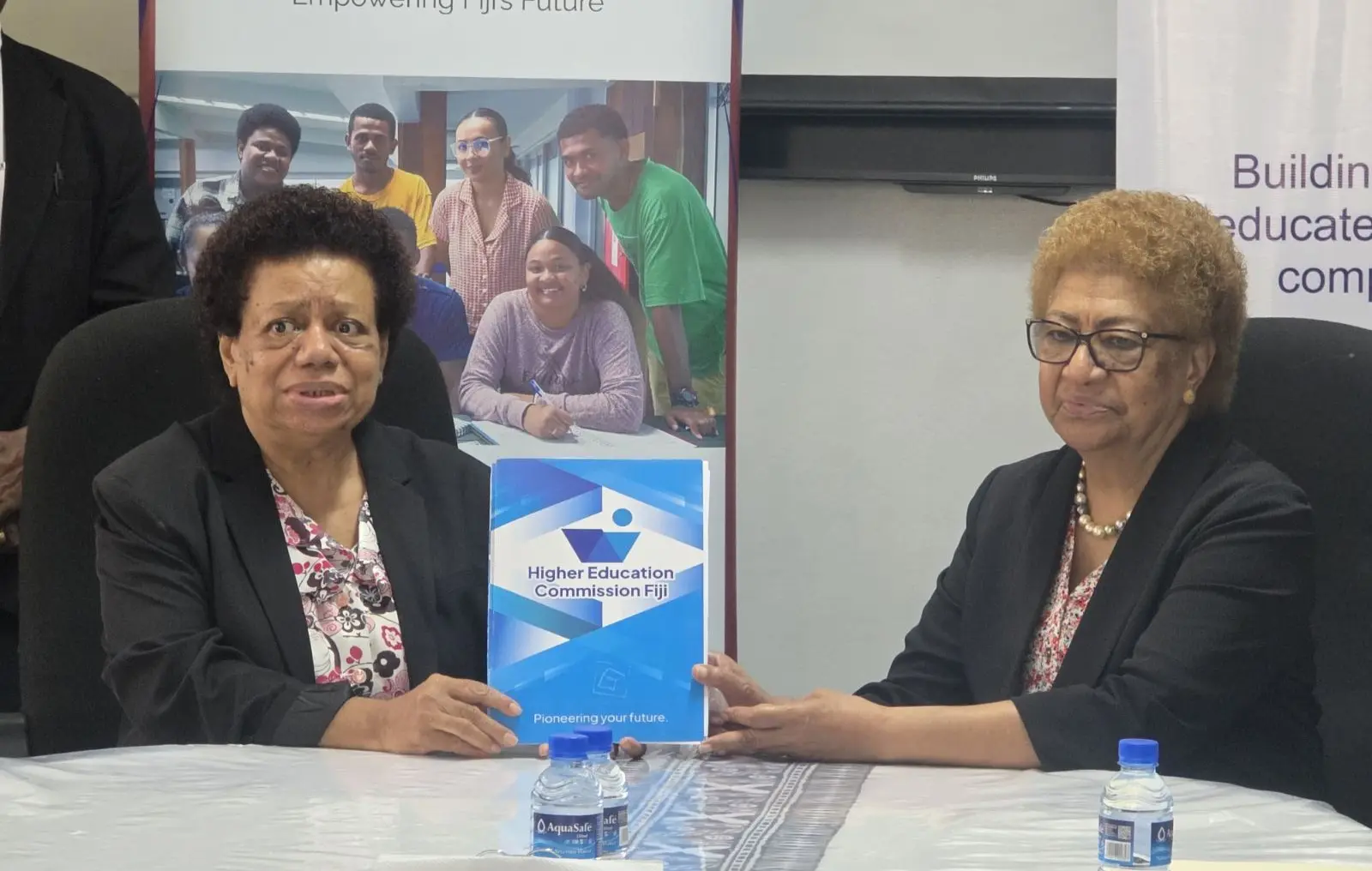 The Higher Education Commission Fiji Rokobua Naiyaga and Tertiary Scholarships and Loans Service chairperson Ro Teimumu Kepa during the signing.