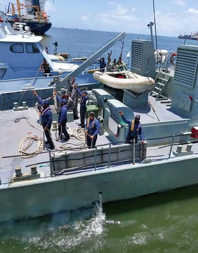 Crew of the RFNS Kula wave goodbye to family members as they set sail for Australia.