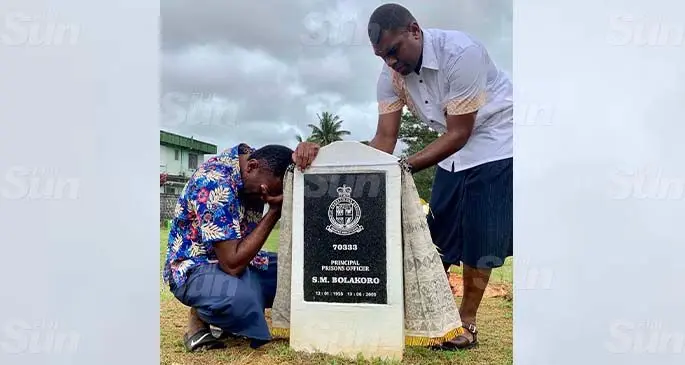 An emotional Moses Bolakoro (left) with a Fiji Corrections Service officer at the unveiling of his late mother’s headstone at the Nasinu cemetry on August 22, 2020. Photo: Inoke Rabonu