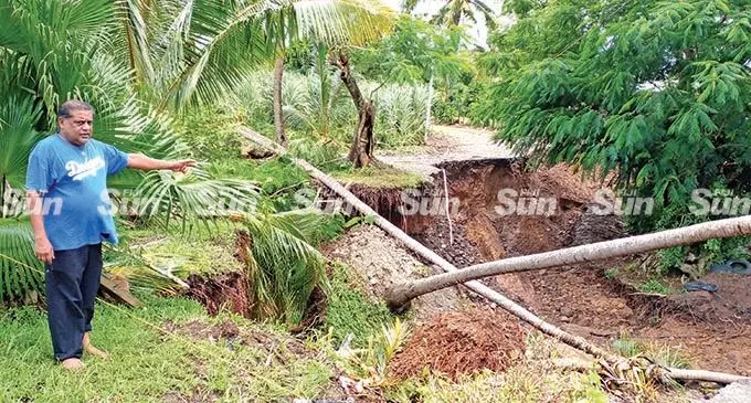  Arvind Naicker points at the area where the roadslide occured at Vatamai Road Number 8 at Lovu, Lautoka  occured near his home. Photo: Salote Qalubau
