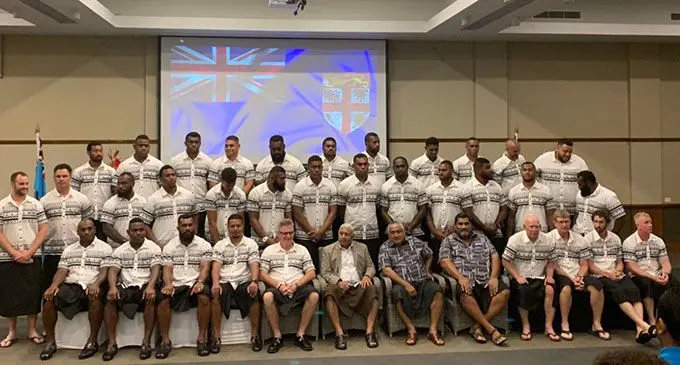 Fiji Airways Flying Fijians players and officials with Fiji Rugby Union president and Prime Minister Voreqe Bainimarama (sitting sixth from left), chairman Francis Kean (seventh from left) and chief executive officer John O’Connor (eighth from left) at Suva’s Grand Pacific Hotel on July 12, 2019. Photo: DEPTFO News