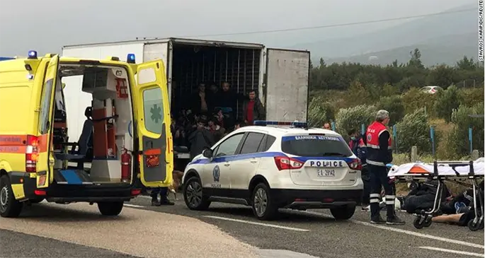 People are seen inside a refrigerated truck found by the police near Xanthi, Greece. Photo: CNN