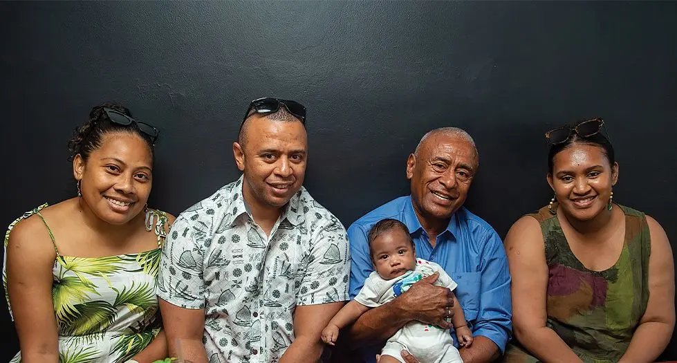 Timoci Silatolu is flanked by his family members. From left: Meme Silatou (daughter in-law), Vitu Silatolu (son), Josefa Silatolu (grandson) and Miriama Tamani (daughter) during their  Christmas lunch in Suva on December 2023. Photo: Leon Lord