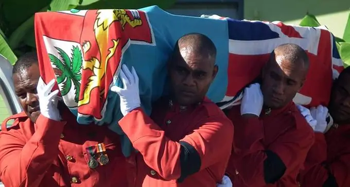RFMF pall bearers carry the casket of the late Private Josese Ledua.  