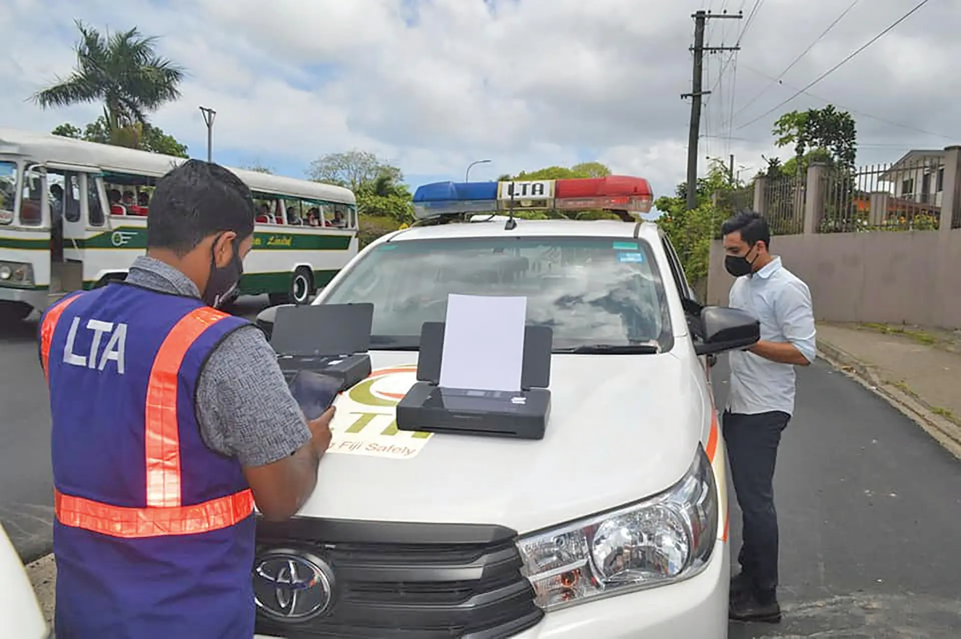 Land Transport Authority officers mends a checkpoint