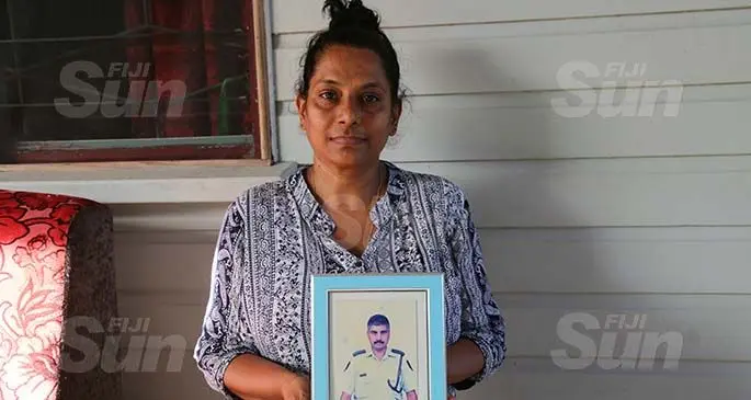 Widow, Aynul Nisha holding a picture of her late husband, Sergeant Raj Gopal Chetty on April 19, 2020. Photo: Kelera Sovasiga