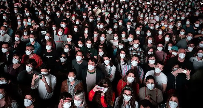 New normal...People wearing face masks attend a music concert in Barcelona, Spain, March 27, 2021