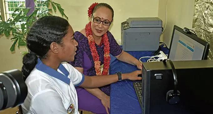 New Zealand Government Minister Jenny Salesa interacts with Lautoka Andhra Sangam College Year 13 student Rosi Tora after opening the  Government Community Telecentre in Lautoka on 22 February 2018. Photo: Arieta Vakasukawaqa