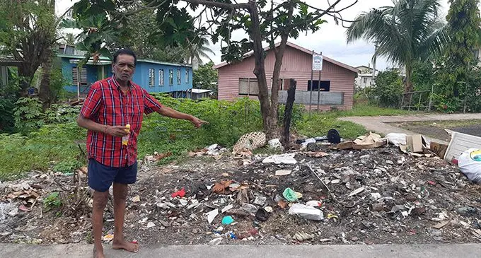 Ramen Chand at the spot where rubbish is being dumped and burnt. His house is located on the opposite side of the road in Jittu Estate. Photo: Shalveen Chand 