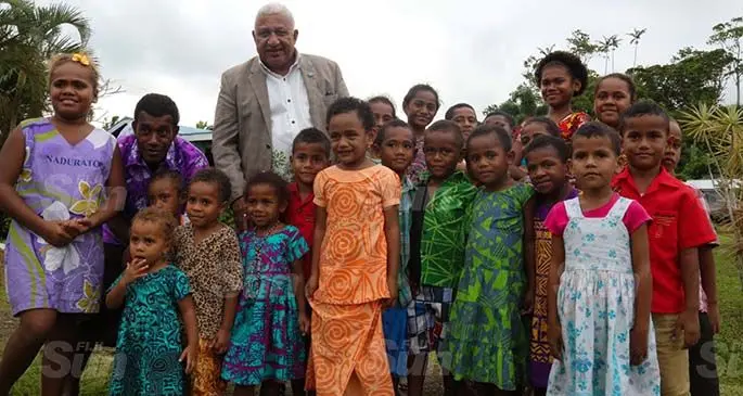 Prime Minister Voreqe Bainimarama with children and villagers of Dravuni during the commissioning of the seawall on June 12, 2020. Photo: Kelera Sovasiga