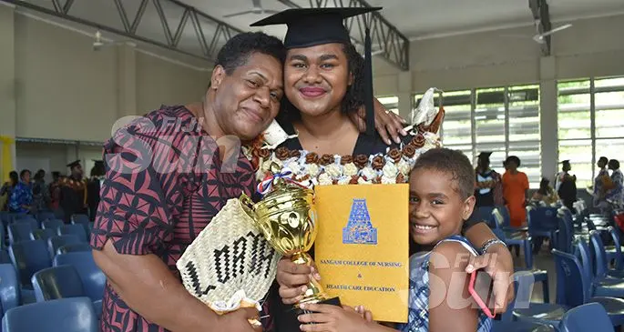 Sangam Institute of Technology (SIT) College of Nursing and Health Care Education graduate Loata Bogidrau (middle), with her mother Akisi Vulavou and sister Grace Vakaloloma after the graduation at the Labasa Civic centre on December 11, 2019. Photo: Shratika Naidu