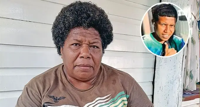 Seini Sakeo, left, with the photo of her daughter Elina Naidike, 20, whose body was discovered near Vitogo, Lautoka, on Saturday afternoon. Photo: Mereleki Nai