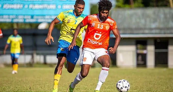  Rewa striker Samuela Nabenia controls the ball as Nadroga defender Paula Buke comes in to challenge him in their Digicel Premier League at Ratu Cakobau Park, Nausori, on April 9, 2022. Photo: Leon Lord.  