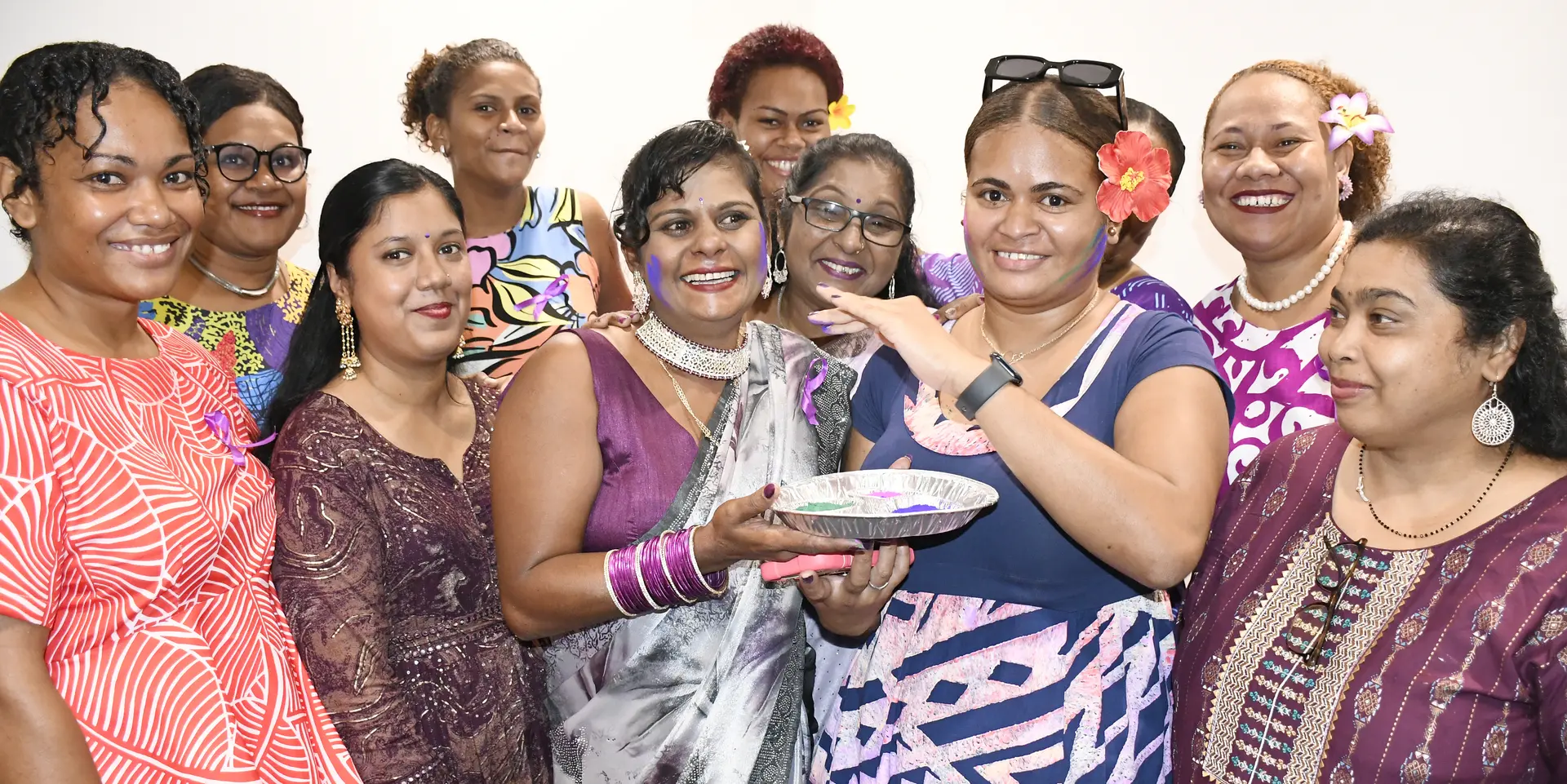Pacific Australia labour mobility (PALM) workers (middle) Manjula Devi and Nanise Nayacakalou share the colours of Holi with other returned workers and Ministry of Labour and Employment during International Women's day celebration at Tanoa Plaza in Suva on March  4, 2026. 