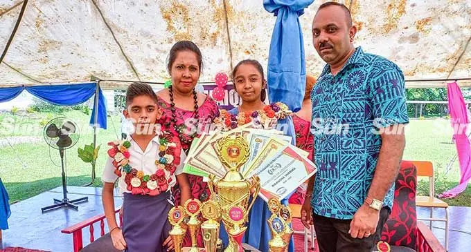 Waiqanake District School Dux Rikansha Sharma is flanked by her family (from left) Vivaan Sharma (brother), Kamni Sharma (mother), and Vinod Sharma (father) during the prize giving ceremony in Lami on March 28, 2022. Photo: Sheenal Charan