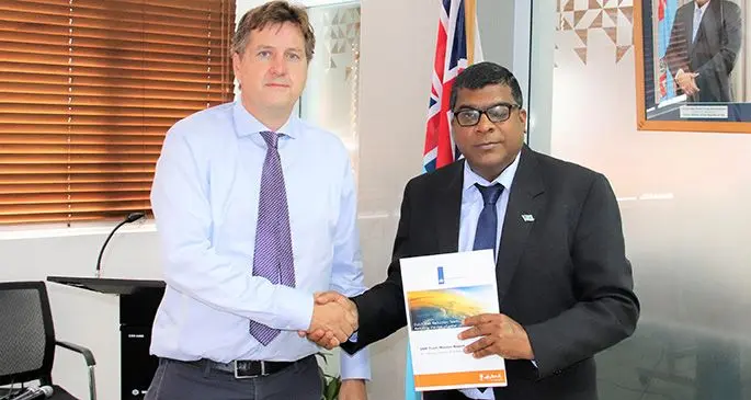 Consultant from Netherlands Roderic Evers presents a report to the Minister for Agriculture, Rural and Maritime Development, Waterways and Environment Mahendra Reddy.