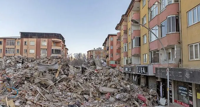 Piles of concrete are seen next to withstanding buildings in the aftermath of a deadly earthquake in Elbistan, Turkey on February 14, 2023. Photo: Reuters