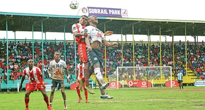 Labasa’s Sitiveni Rakai in an aerial battle with Suva striker Christopher Wasasala during the Vodafone Fiji FACT semi-final at Subrail Park, Labasa on December 5, 2020.  Photo: Fiji Football Association