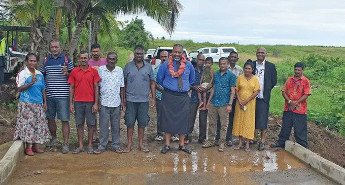 Anaseini Lakai(standing far left), Minister for Rural and Maritime Development and Disaster Management Sakiasi Ditoka with government officials and Nasau community members at Nasau in Nadi. Photo: Mereleki Nai