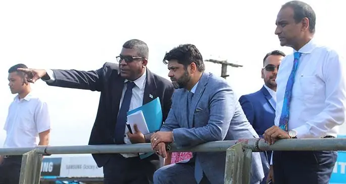 Minister for Waterways and Environment Mahendra Reddy (left), with Attorney-General Aiyaz Sayed-Khaiyum at the installation of Fiji’s first floating trash net. Photo: Ministry of Environment