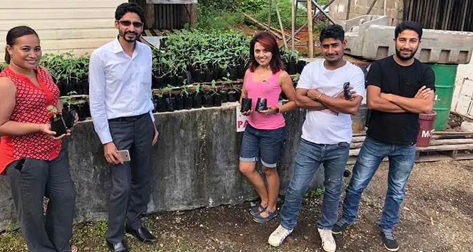 Touch Wood Fiji director Imaar Qamer, second from left, with chillie plants which will be distributed to families in Deuba.