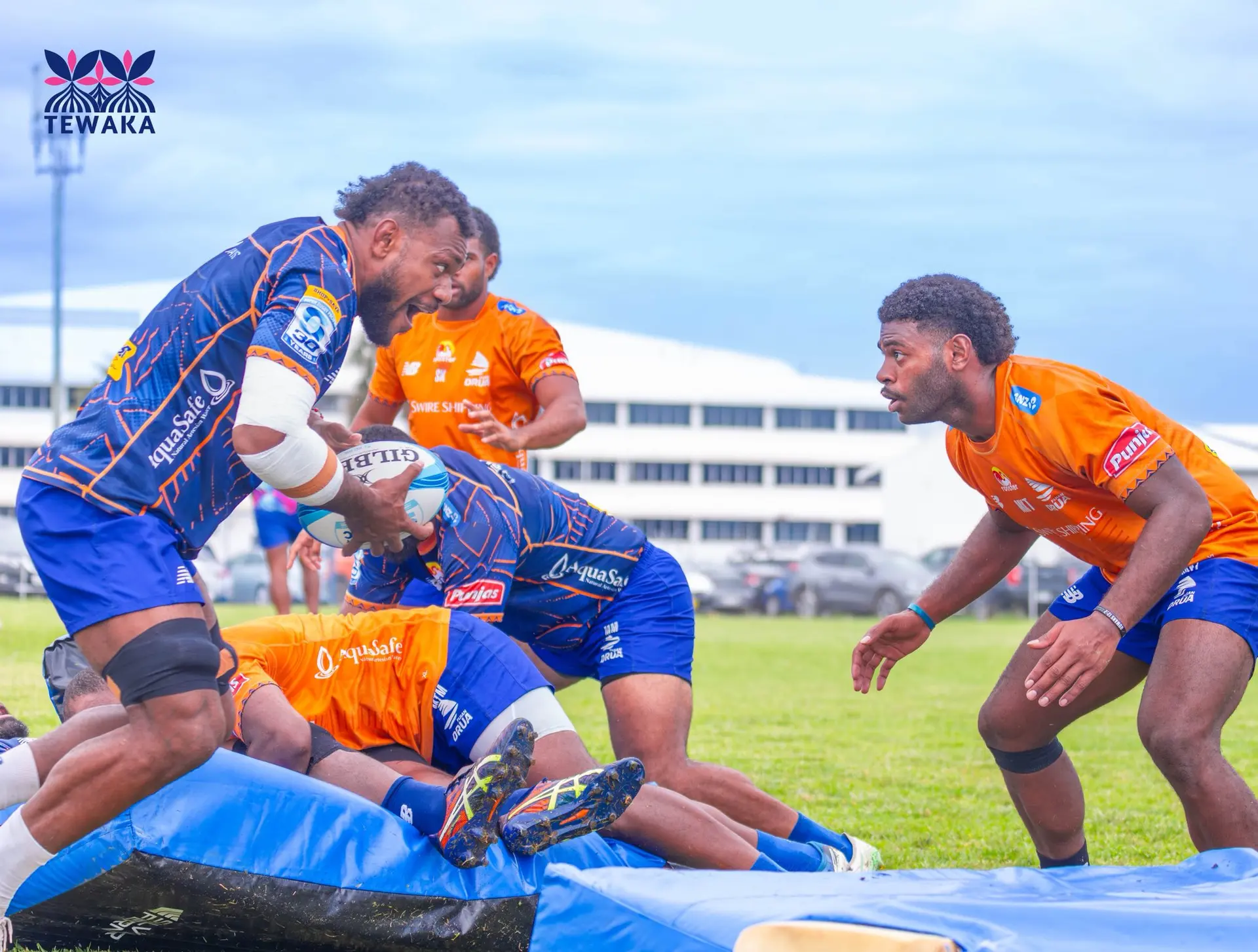 Fijian Drua No.8 Elia Canakaivata leads the charge as center Maika Tuitubou ready to defend during training at the Drua homebase in Legalega, Nadi, on April 23, 2026. Tuitubou will be making his Shop N Save Super Rugby Pacific debut against Chiefs on Sunday.  Photo: Fijian Drua