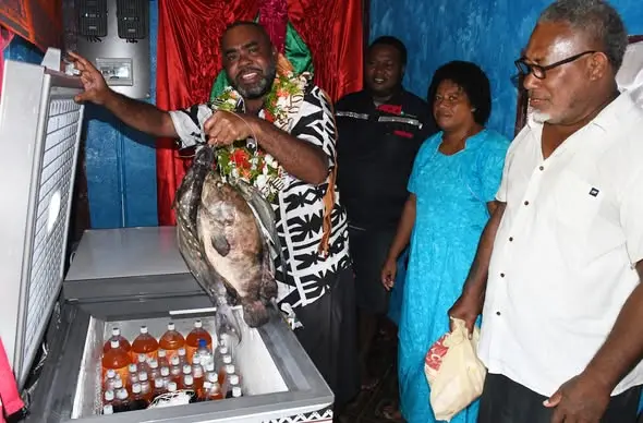 Minister for Rural and Maritime Development and Disaster Management, Mosese Bulitavu hands over solar deep freezers for women in Udu, Macuata.