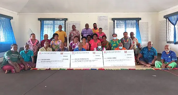 Minister for Lands and Mineral Resources Jone Usamate (seated sixth from left), Amex Resources Limited general manager Alivereti Tuidravuni (with garland, fifth from right) with the Vanua O Votua representatives and guests during the payout Votua Village in Ba on March 2, 2022. Photo: Ministry of Lands and Mineral Resources.