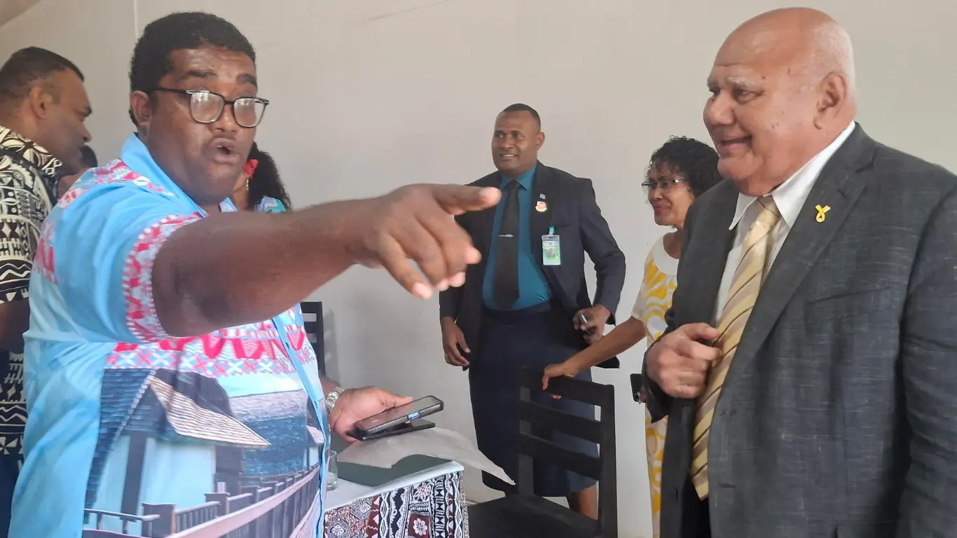 Leone Tagicakibau (left) speaking with Tourism Minister Viliame Gavoka at the George Shiu Raj Hall in Rakiraki.