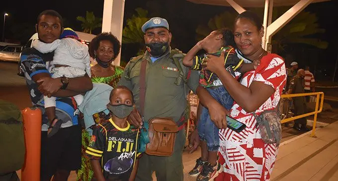 Private Gonelevu Bati surrounded by his family at the Nadi International Airport on April 15, 2022. Photo: Mereleki Nai