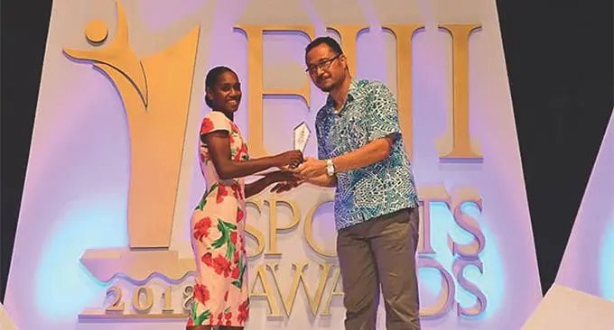 Filomena Faliki (left), received the Fiji Sports Council 2018 Fiji Sports Award Young Female Athlete of the Year from CJ Patel Group of Companies general manager manufacturing Moses Hicks at FMF Gymnasium on March 01, 2019.