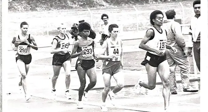 Salome Tabuatalei (right) leads one of the women’s long distance events during the South Pacific Games. Photo: FASANOC