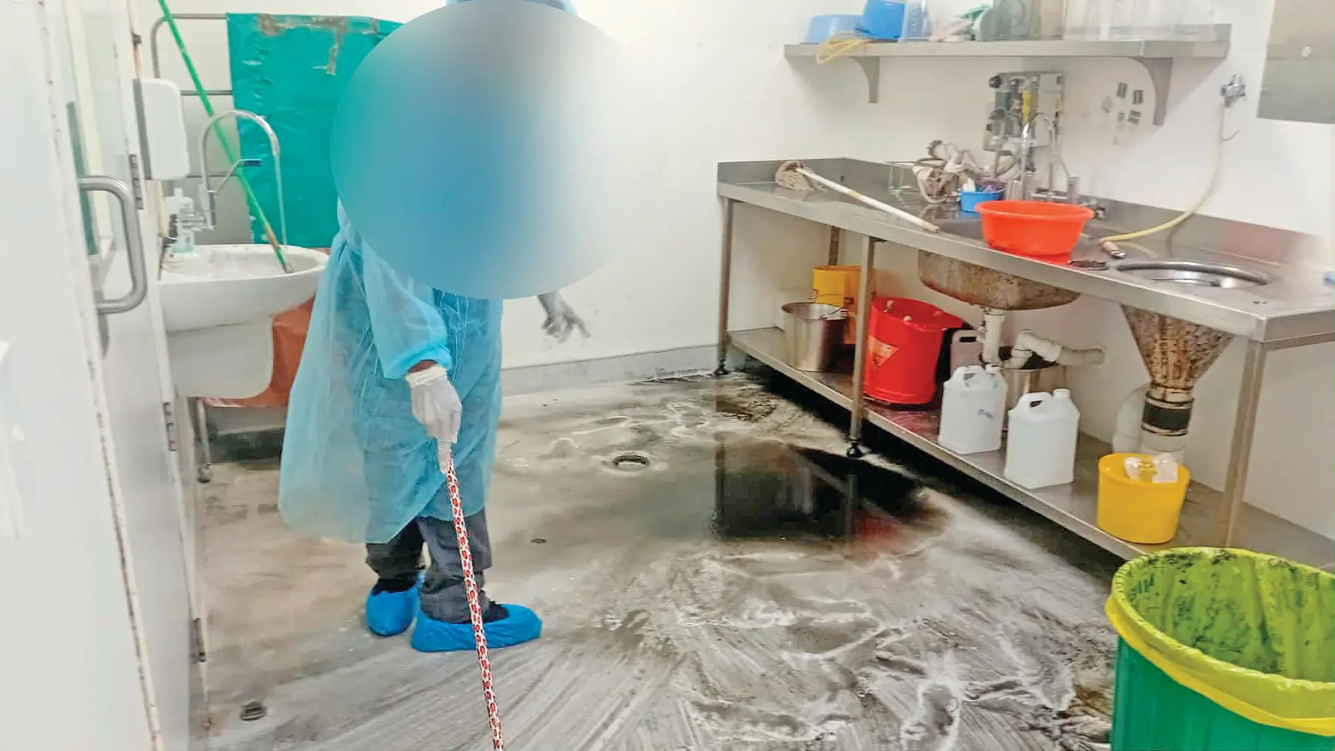 Pictures show the extent of the contamination within the operating theatre, including damp hospital linens hung to dry over blocked drains, sinks filled with murky water.