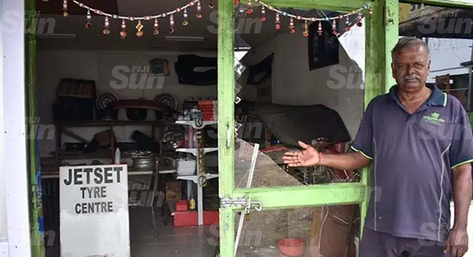 Jet Set Tyre Centre Owner, Awad Ram beside the broken glass door at his shop in Nadi. Photo: Mereleki Nai