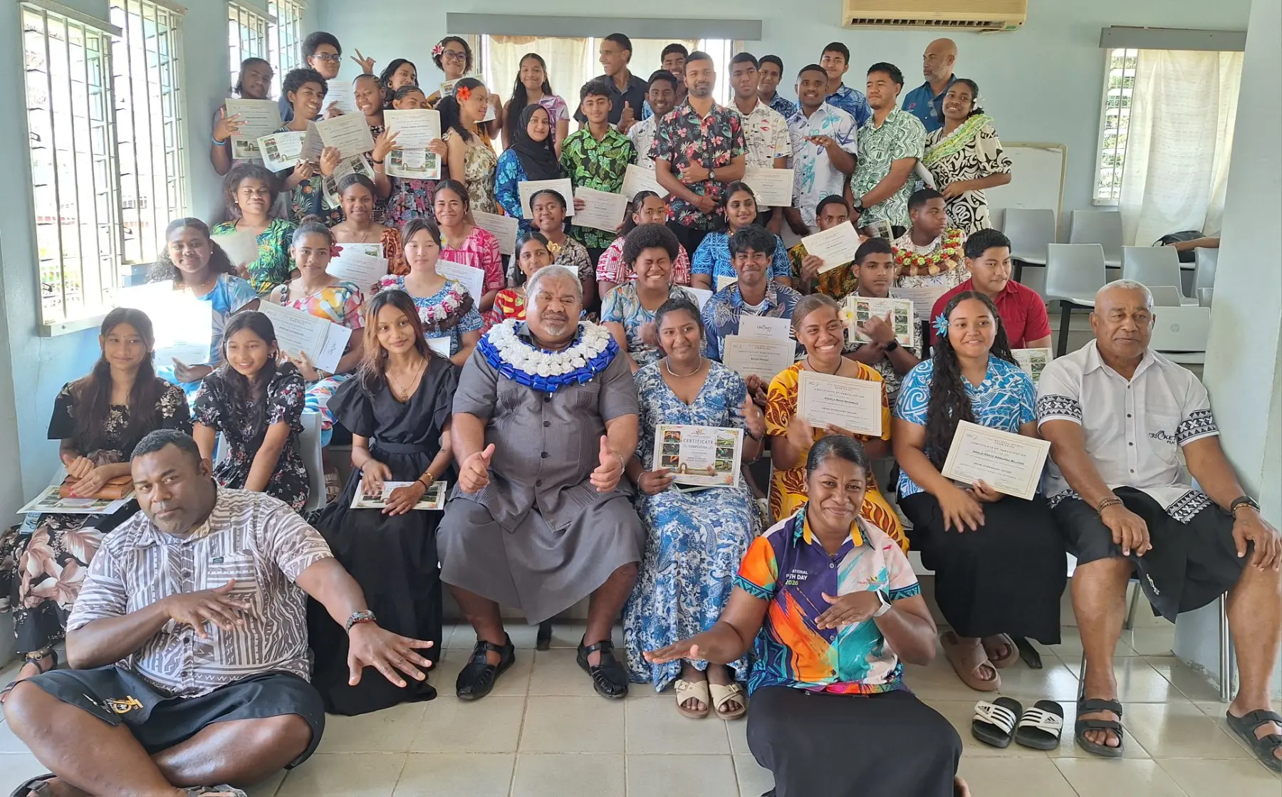 Minister for Youth and Sports Jese Saukuru (sitting fourth from left, in garland) with graduates and trainers at the closing of the Educational, Youth and Sports Training Programme at Swami Vivekananda College Hall in Nadi on September 4. Photo: Katherine Naidu.