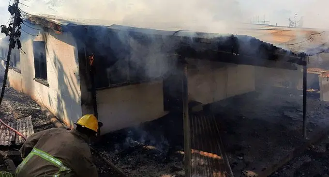 An NFA firefighter controlling the fire which destroyed a home at Navatu Lane in Waiyavi, Lautoka on August 28, 2022. Photo: National Fire Authority