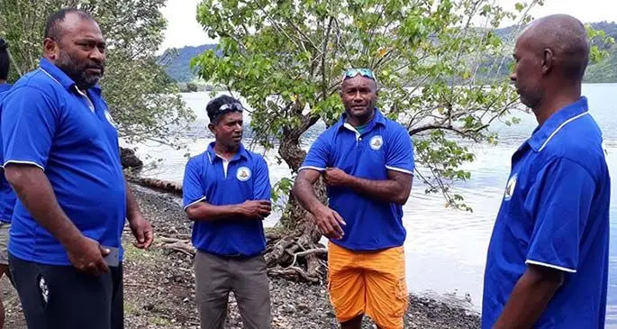 Minister for Health and Medical Services, Dr Ifereimi Waqainabete ( left) being briefed by the Fiji Emergency Medical Assistance Team who were leaving for Taveuni from Natuvu jetty in Vanualevu. Photo: Ministry of Health and Medical Services