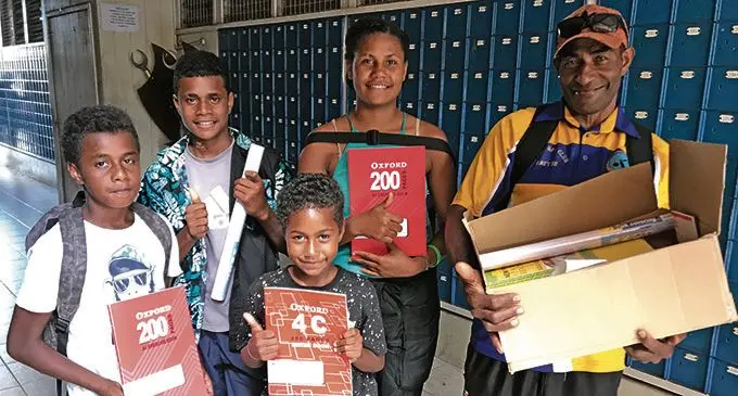 Nikola Drevula (right) with his children Titilia Ditemani, Kitione Malumulevu, Manasa Raisa and Ekari Waqanibau at Post Shop Fiji in Labasa on December 30, 2020.  Photo: Shratika Naidu