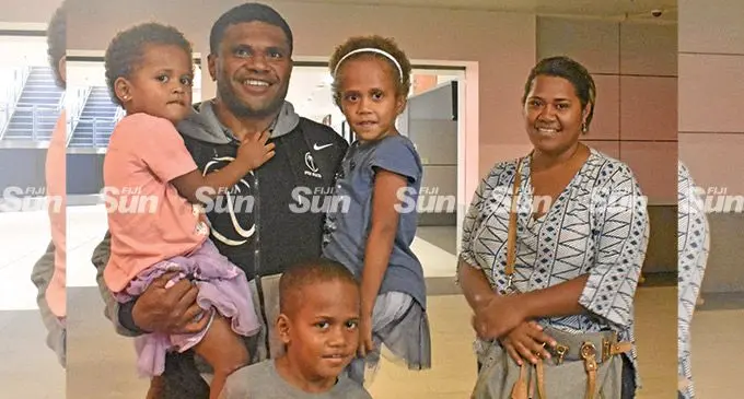Fiji Airways Fijian 7s captain Tevita Daugunu with family members at the Nadi International Airport. Photo: Mereleki Nai