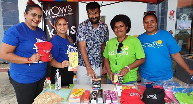 RC Manubhai Regional Manager - central, Shanil Patel with staff and volunteers of WOWs Kids Fiji at their Suva branch.