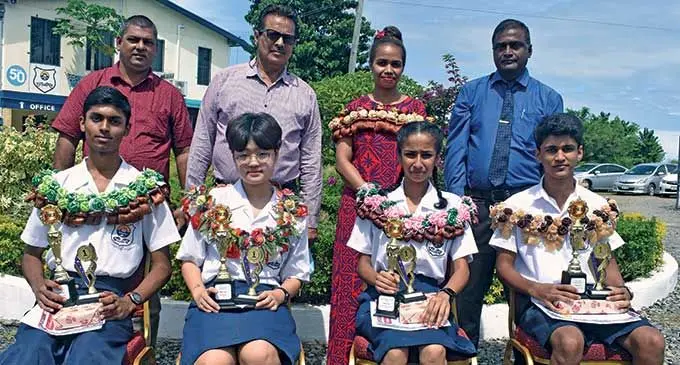 Standing (From left): Suresh Pratap (board member), Sunil Sharma (board member), Chief Guest Kelera Railoa, and school principal Ramesh Chand. Sitting (From left): Year 12 Dux, Raheem Nath, Year 11 Dux, Mina Cho, Year 10 Dux Charlotte Krishna and Year 9 Dux Shivesh Sharma at Votualevu College. Photo: Mereleki Nai