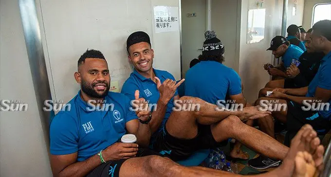 Photo caption: France-based backs (left-right) Vilimoni Botitu and Ben Volavola with their team-mates on board the Lomaviti Princess ferry to Taveuni on July 1, 2023. Photo: Leon Lord  