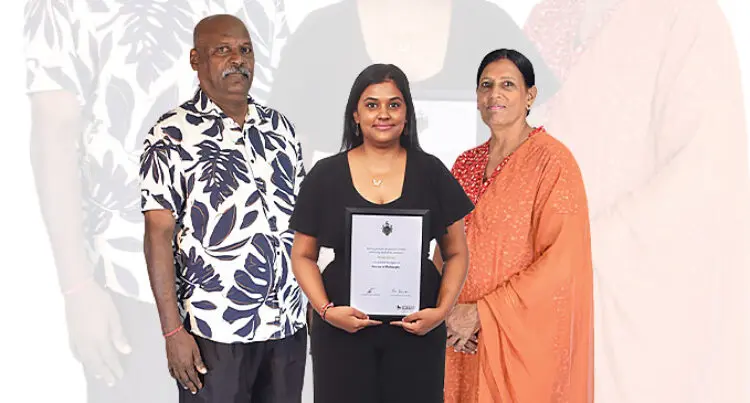 Pooja Chand is flanked by her parents Philip Anil and Sarojni Chand.