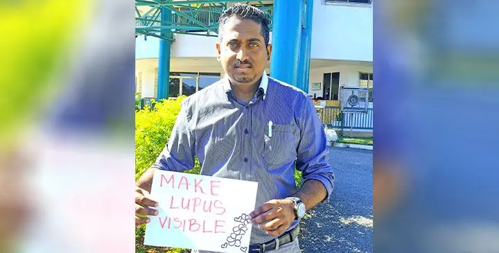 Dr Vishal Kumar shows the theme of this year’s World Lupus Day.