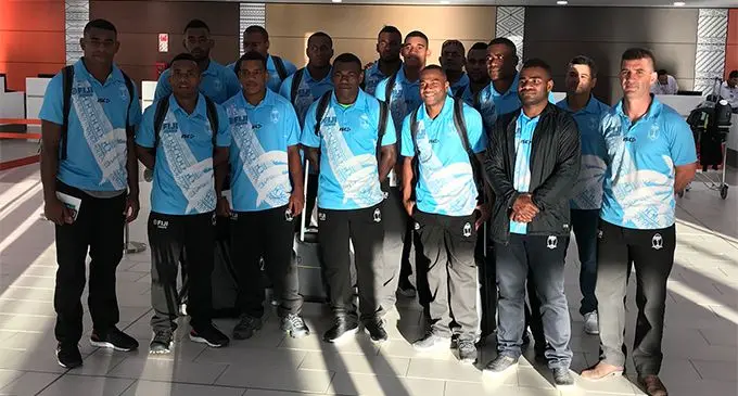 Fiji Airways Fijian 7s rep Napolioni Ratu (closest to camera) and Vilimoni Botitu (third from right) with fans at the Nadi International Airport on March 28, 2019. Photo: Waisea Nasokia